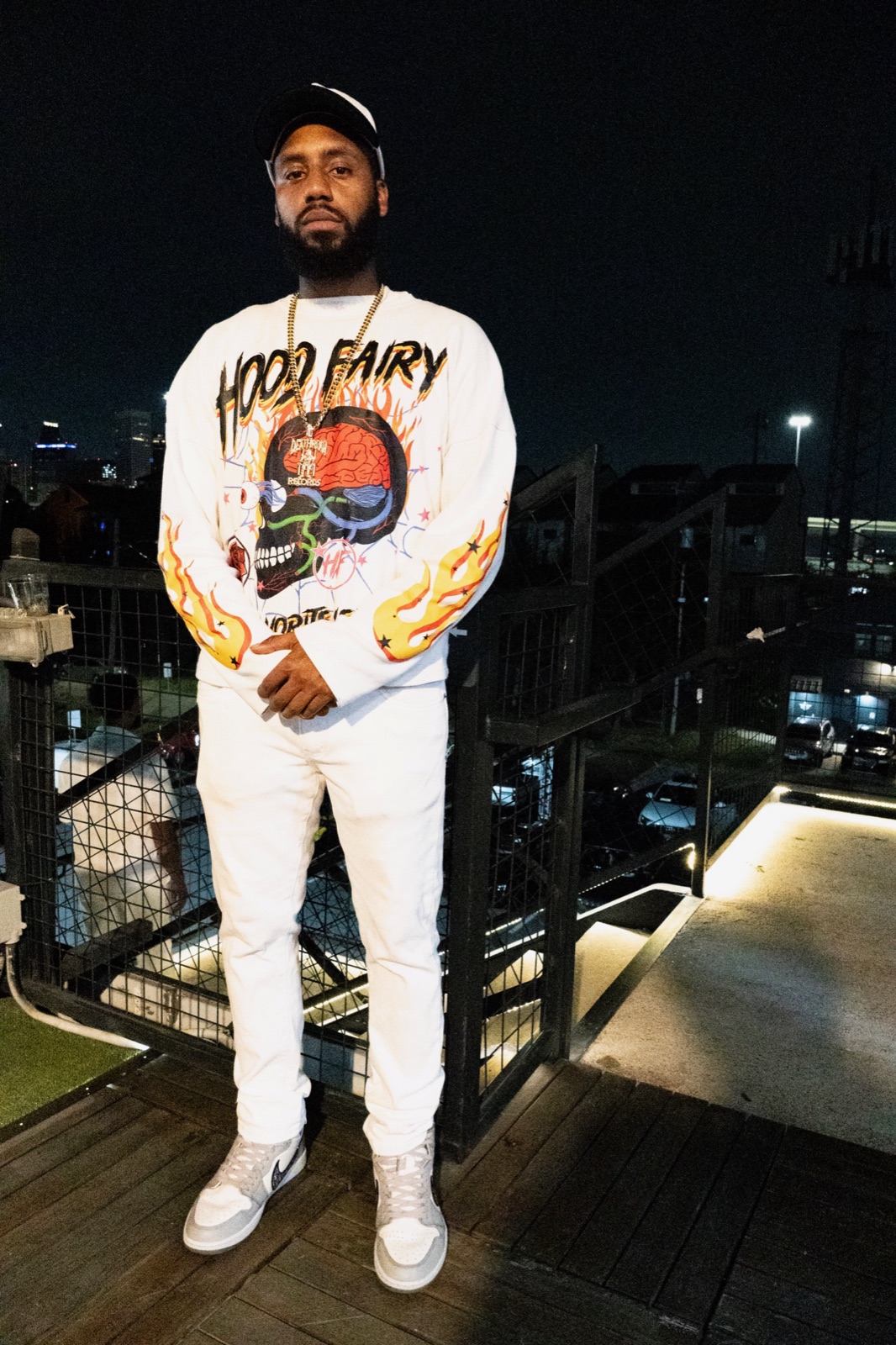 Christian Bernard on a rooftop at night